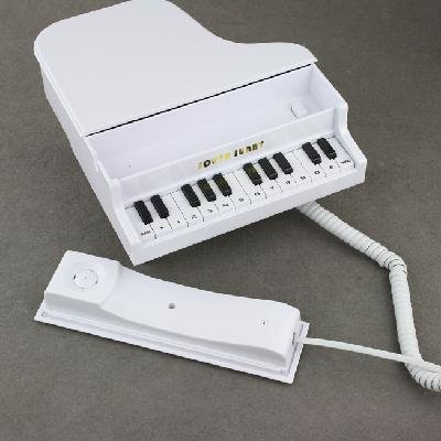 Стационарный телефон в форме фортепиано